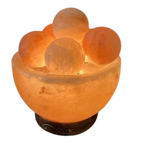 A Himalayan fire bowl salt lamp with massage balls, combining a warm glow and therapeutic features for relaxation.
